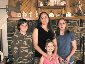 Christina Duval and her children at their home